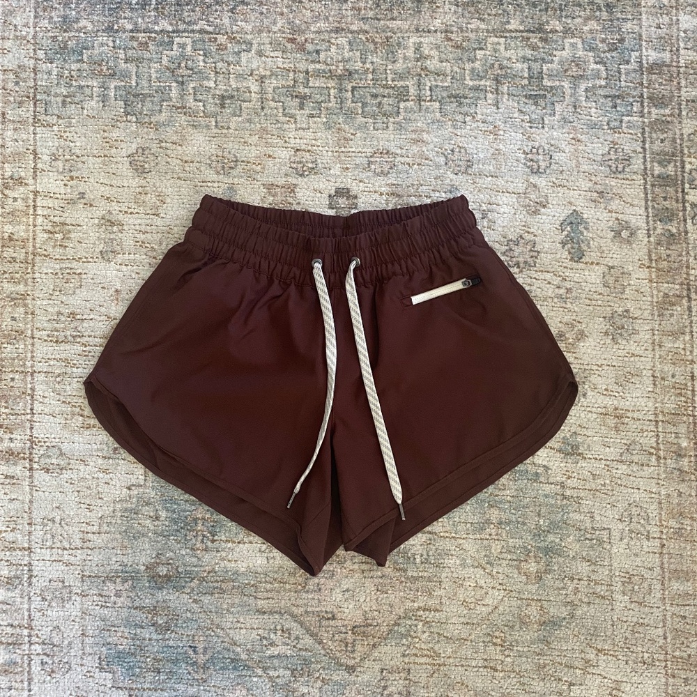 Vuori Women's Athletic Shorts in Deep Burgundy